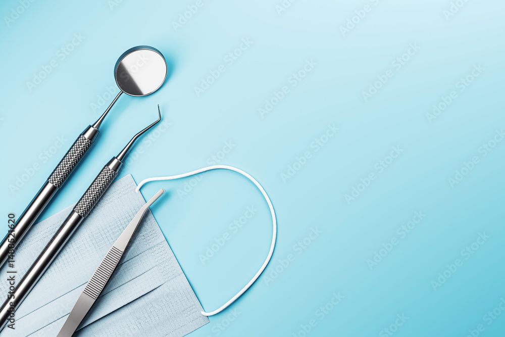 Poster dental tools and surgical mask on light blue gradient background with empty space for text, modern c