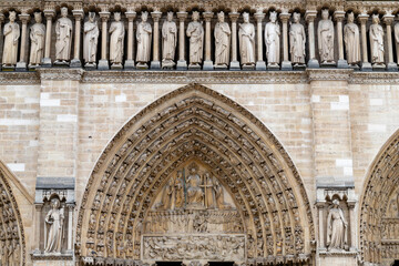 Paris, France-April 16, 2025: Statues and Arch Detail at Notre-Dame