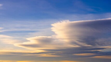 Dramatic sky with swirling cirrus clouds in shades of blue, white, and gold creating an abstract ethereal atmosphere - Powered by Adobe