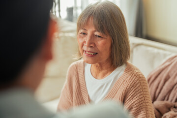 Asian retired old woman with Financial advisor talking Authentic shot of asian elderly couple want...
