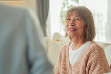 Asian retired old woman with Financial advisor talking Authentic shot of asian elderly couple want...