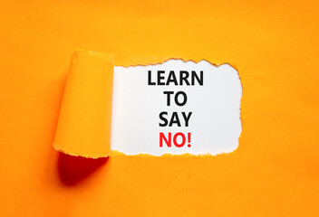 Learn to say no symbol. Concept words phrase Learn to say no on beautiful white paper. Beautiful orange paper background. Business psychological Learn to say no concept. Copy space.