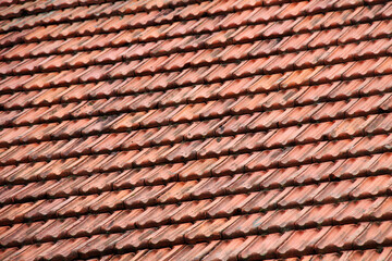 The roof of the house is covered with old red tiles
