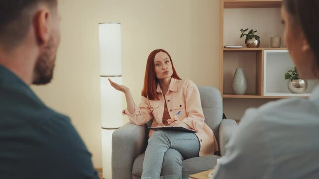 Man and woman engage in mediation session with psychologist, working through their disagreements in a structured conversation. Professional setting. Concept: negotiation, understanding, compromise