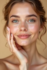 Young woman with glowing healthy skin holds hands on face in contemplative pose, showcasing natural beauty and radiant complexion with soft lighting and neutral background