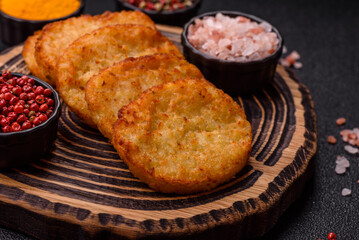 Potato hash browns, a meal with onions, cabbage in the form of fritters