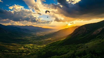 A man is flying a kite in a beautiful landscape with mountains in the background