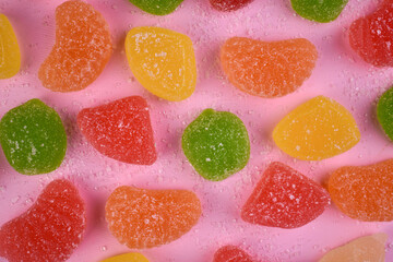 Jelly candies, marmalade on a pink background.
