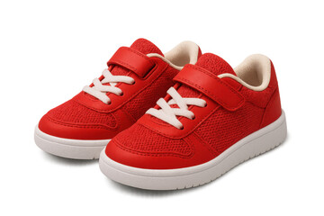Kids' red sneakers floating on clear backdrop, highlighting playful footwear design for fashion graphics and creative compositions