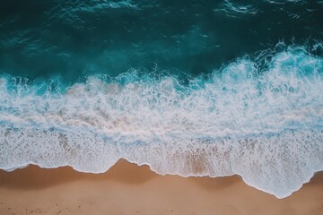 Ocean waves crashing on sandy shore create a captivating coastal view, Aerial view of ocean waves crashing onto sandy shore