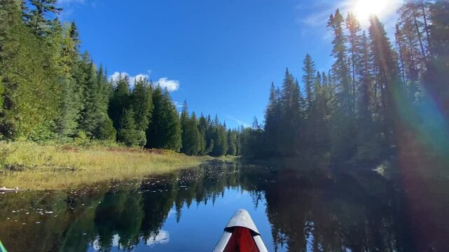 Timelapse of the front of a canoe as it glides through the winding rivers of Temagami, Ontario