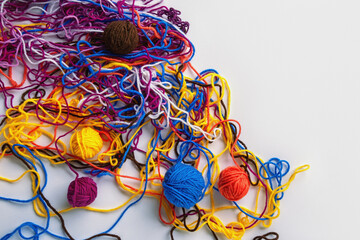 Colorful tangled threads and  winding them into balls. Concept of problem solution. Copy space