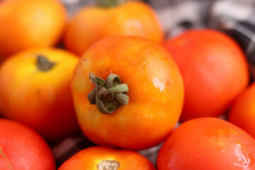 Fresh red tamotoes with kitchen cloth and kept in a bowl, healthy vegetable in the kitchen