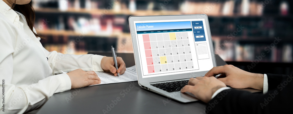 Poster calendar on computer software application for brisk schedule planning for personal organizer and onl