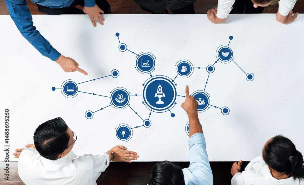 Poster a diverse team engage in active collaboration, analyzing interconnected ideas represented by a rocke