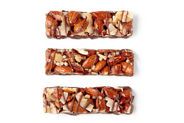 three nut caramel bars isolated on white background. top view with copy space