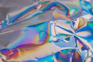 Image showcases iridescent foil with a vibrant color spectrum, suggesting high-end or luxurious...