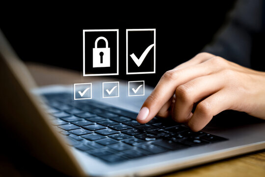 Hand interacting with laptop keyboard.Online transaction security concept with confirmation check marks and lock symbol in digital workspace - Powered by Adobe
