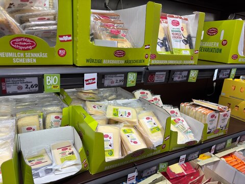 Kitsse, Austria - 17 May 2025: Store shelves in Hofer filled with a wide variety of cheeses including hard, soft, sliced, and packaged dairy products.