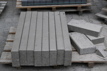 Fototapeta premium Edging stones on a wooden pallet on a building site, infrastructure sector