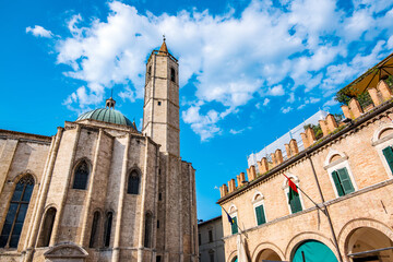 Cattedrale di Sant'Emidio and Palazzo Comunale standing tall in Piazza Arringo, Ascoli Piceno, Italy, showcasing the city's rich history and stunning architecture under a vibrant blue sky