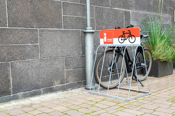 Black bicycle parked on the cobbled street in the old city.