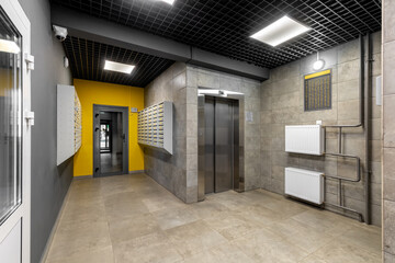 Mailroom Elevator Lobby with Yellow Accent