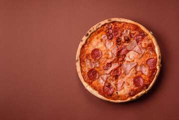 Italian pepperoni pizza with cheese and salami, tomatoes and sauce