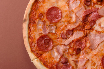 Italian pepperoni pizza with cheese and salami, tomatoes and sauce