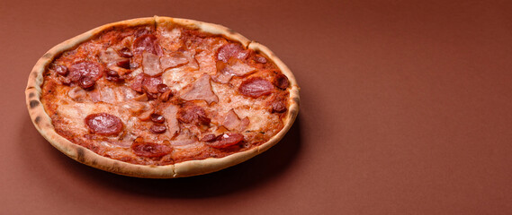 Italian pepperoni pizza with cheese and salami, tomatoes and sauce