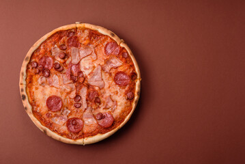 Italian pepperoni pizza with cheese and salami, tomatoes and sauce