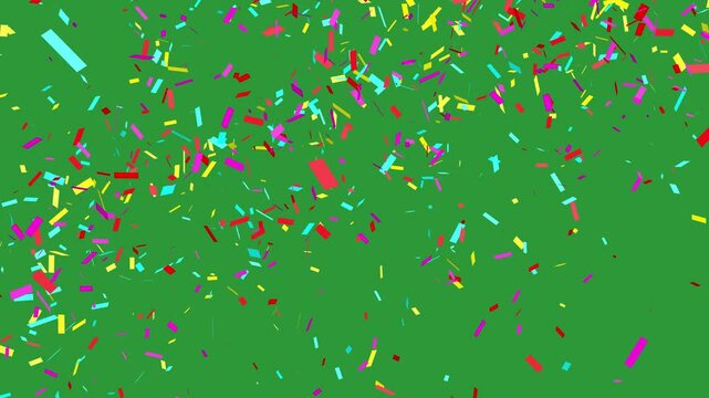 Confetti falling with green screen. Multi-color paper over chroma key backdrop for editing into celebration or congratulations video.