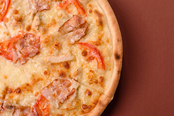 Italian pizza with chicken and bacon, cheese, tomatoes and sauce