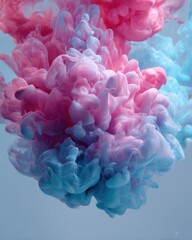 Abstract paint splash of pink and blue ink in water, creating an ethereal and captivating visual effect
