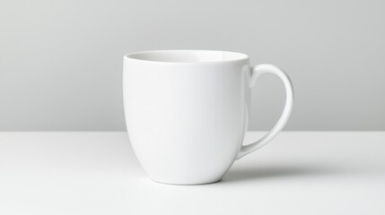 Fototapeta premium A white ceramic mug with a handle.