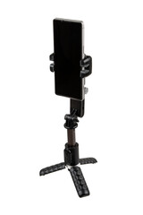 Naklejka premium Smartphone mounted on compact gimbal stabilizer tripod, isolated on white back