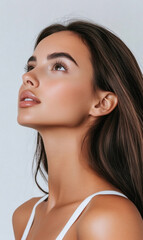 Portrait of a Young Woman Looking Up Thoughtfully - Pensive Beauty