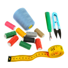 Sewing supplies (thread, scissors and measuring tape ) isolated on a white background.