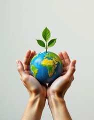 Hands Holding a Small Earth with a Growing Plant on Top