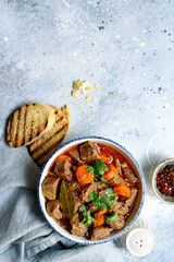 Goulash (meat stew with tomatoes and paprika) - traditional dish of hungarian cuisine .Top view with copy space.