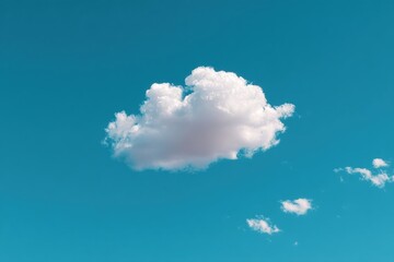 Single puffy cloud against a vibrant cerulean sky.