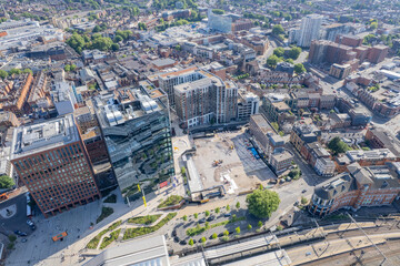 Epic aerial view of Reading center and railway station, and commercial buildings, Berkshire, United Kingdom