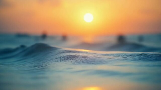 Abstract aerial sea summer ocean sunset nature background. Small waves on water surface in motion blur with golden bokeh lights from sun. Holiday, vacation and recreational concept. Slow motion