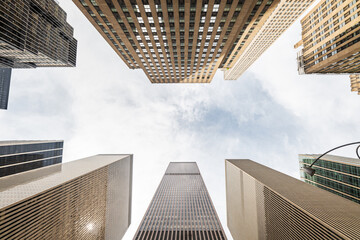 Low-angle view of modern skyscrapers in Manhattan, New York City.