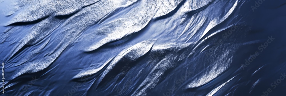 Poster abstract patterns created by light reflecting on dark textured surface in a tranquil setting