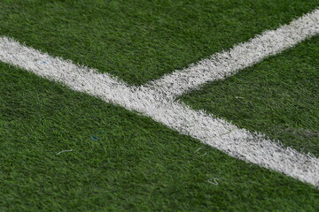 White lines on a green artificial turf pitch Football