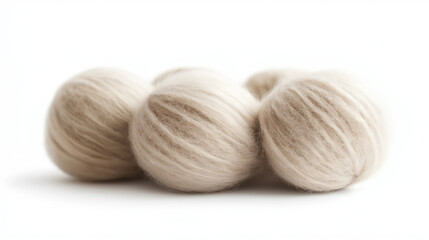 Balls of off white  wool neatly wound, isolated on a white background. 
