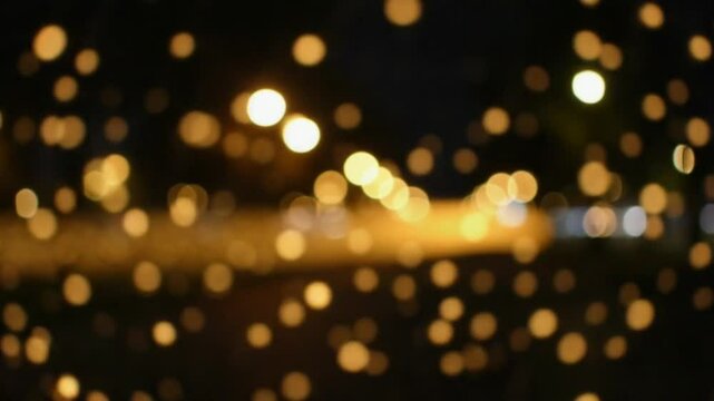 The bokeh lights in the city park at night evoke a sense of nostalgia reminiscent of fireflies on a summer evening and adding a touch of enchantment to the scene. Light leaks.
