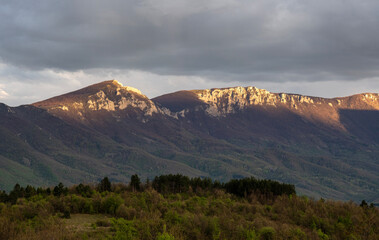 View of the Suva Planina mountain range. Open landscape photography. The sun shines on a huge...