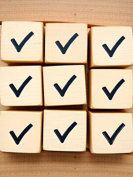 Wooden blocks display checkmarks to summarize task details and compile lists, votes, and to-do lists. Checklists, task lists, lists, and summaries Choose document checklists and online quality assessm